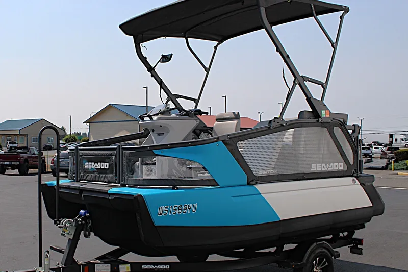 Slide: The Image of 2023 Sea-Doo Switch Sport Compact on trailer, featuring blue and white design. - 10