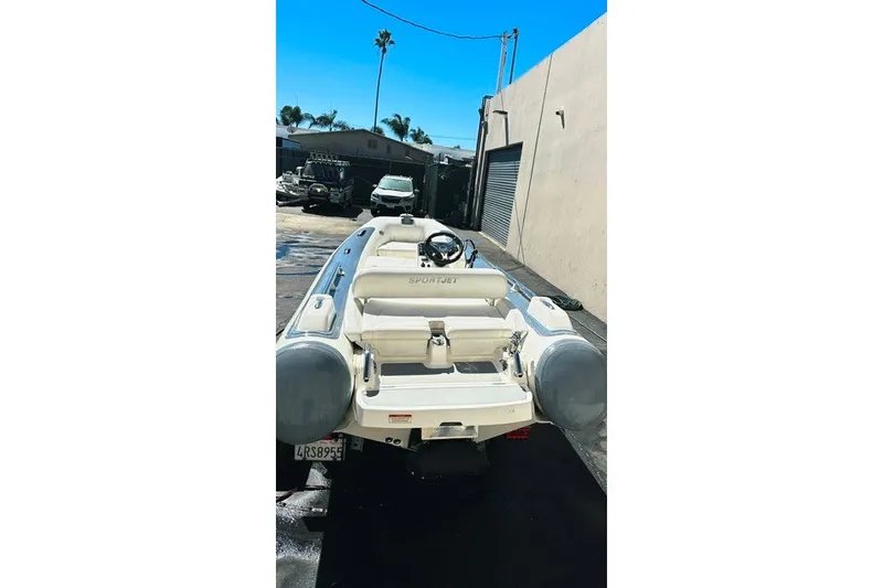 Slide: The Image of 2018 Williams Jet Tenders Sportjet 395 in a sunny outdoor setting. - 2