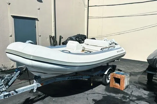 Slide: The Image of 2018 Williams Jet Tenders Sportjet 395 on trailer, parked outdoors. - 1