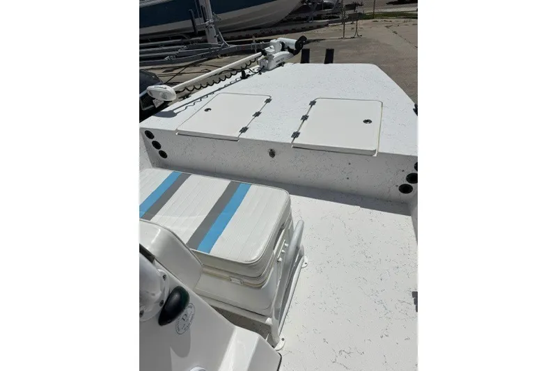 Slide: The Image of 2019 Freedom Boats 18' Patriot deck with storage compartments and seating. - 13