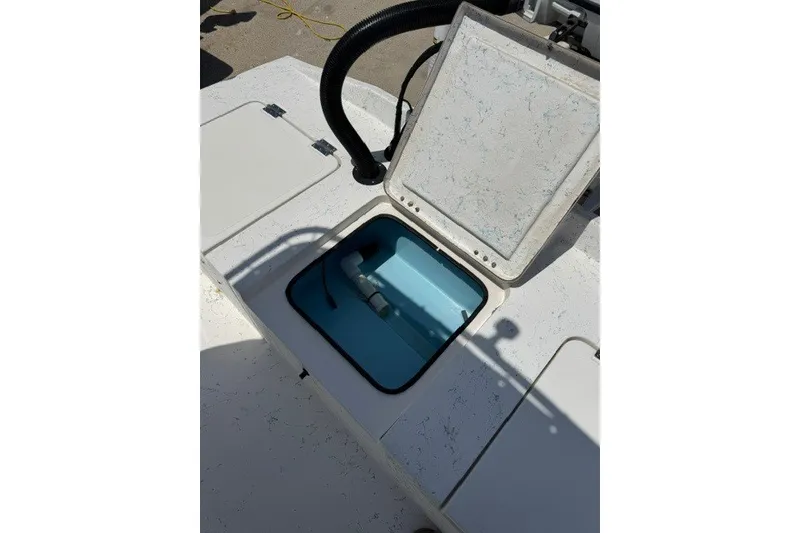 Slide: The Image of Open storage compartment on a 2019 Freedom Boats 18' Patriot. - 15
