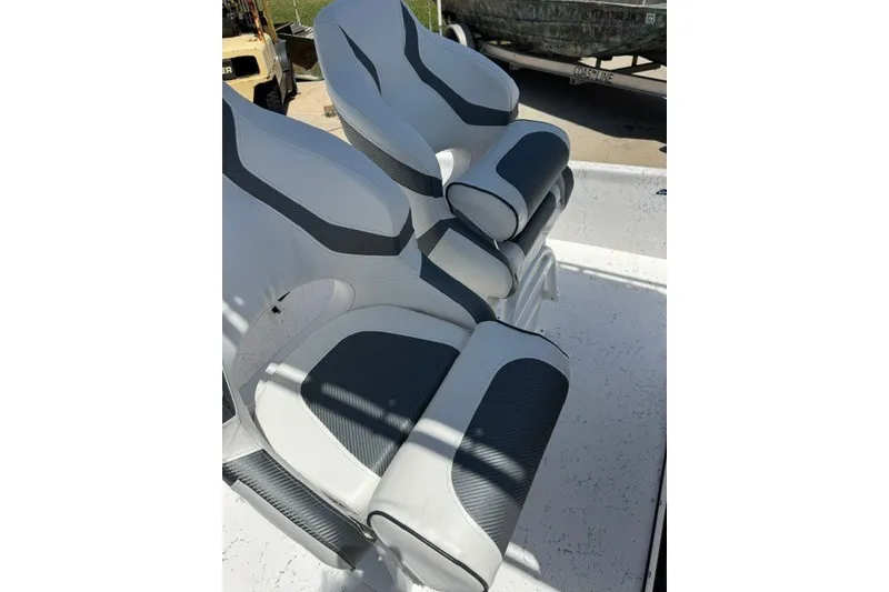 Slide: The Image of 2019 Freedom Boats 18' Patriot interior seating with sleek, modern design and comfortable cushions. - 14