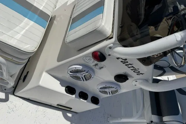 Slide: The Image of 2019 Freedom Boats 18' Patriot console with speakers and seating detail. - 16