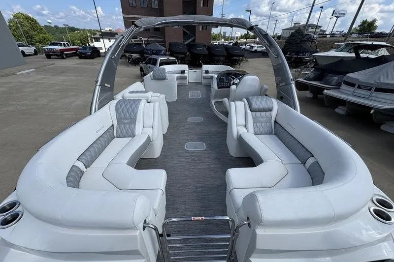 Slide: The Image of 2024 Bennington 30 QXFBAX2 pontoon boat with luxurious seating and modern design. - 6