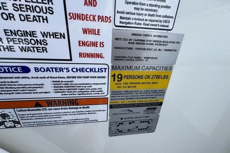 Slide: The Image of Safety and capacity labels on a 2024 Bennington 30 QXFBAX2 boat. - 13