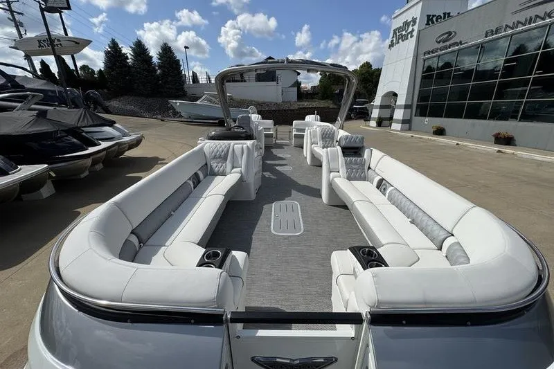 Slide: The Image of 2024 Bennington 30 QXFBAX2 pontoon boat with luxurious seating and modern design. - 12