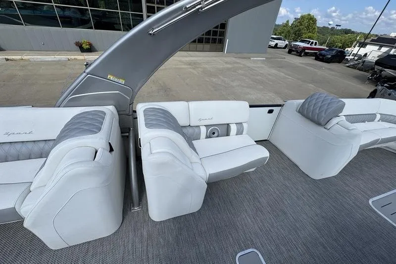 Slide: The Image of 2024 Bennington 30 QXFBAX2 boat interior with luxurious white seating and modern design. - 9