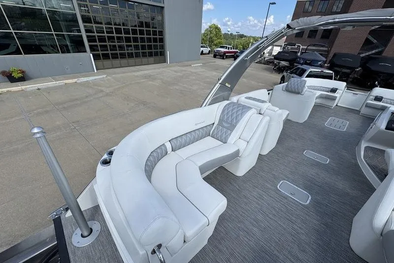 Slide: The Image of 2024 Bennington 30 QXFBAX2 pontoon boat with luxurious seating and modern design. - 8