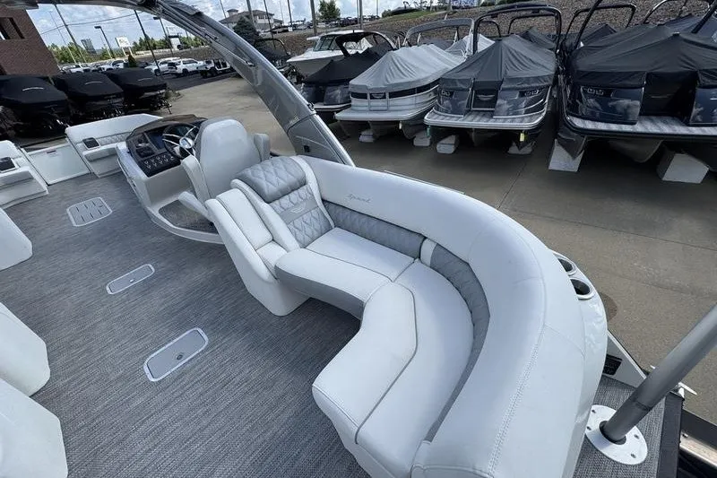 Slide: The Image of 2024 Bennington 30 QXFBAX2 pontoon boat with luxurious seating and modern design. - 7