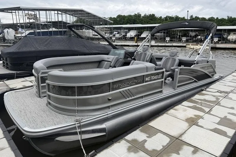 The Image of 2025 Bennington 24 MFB pontoon boat docked at a marina. - 1