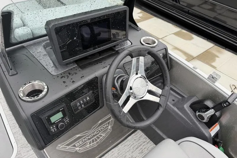 Slide: The Image of Cockpit of 2025 Bennington 24 MFB boat with steering wheel and control panel. - 12