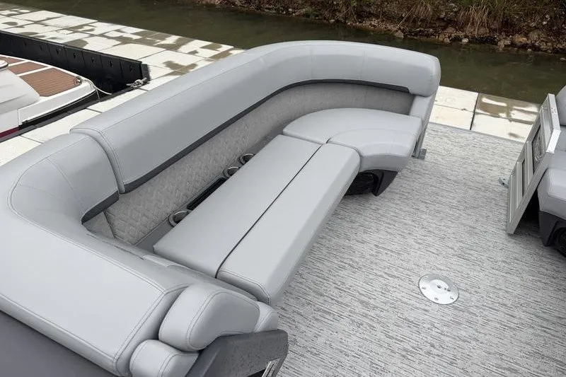 Slide: The Image of Luxurious seating on 2025 Bennington 24 MFB pontoon boat, featuring sleek gray upholstery. - 13
