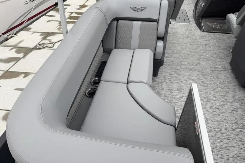Slide: The Image of 2025 Bennington 24 MFB boat interior with luxurious gray seating and cup holders. - 8