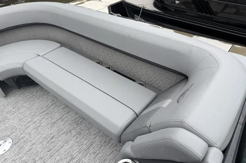 Slide: The Image of Luxurious seating on 2025 Bennington 24 MFB pontoon boat with gray upholstery. - 14