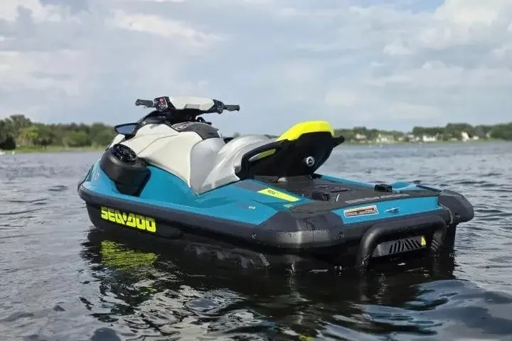 Slide: The Image of 2026 Sea-Doo GTI SE 170 jet ski on a calm lake. - 4