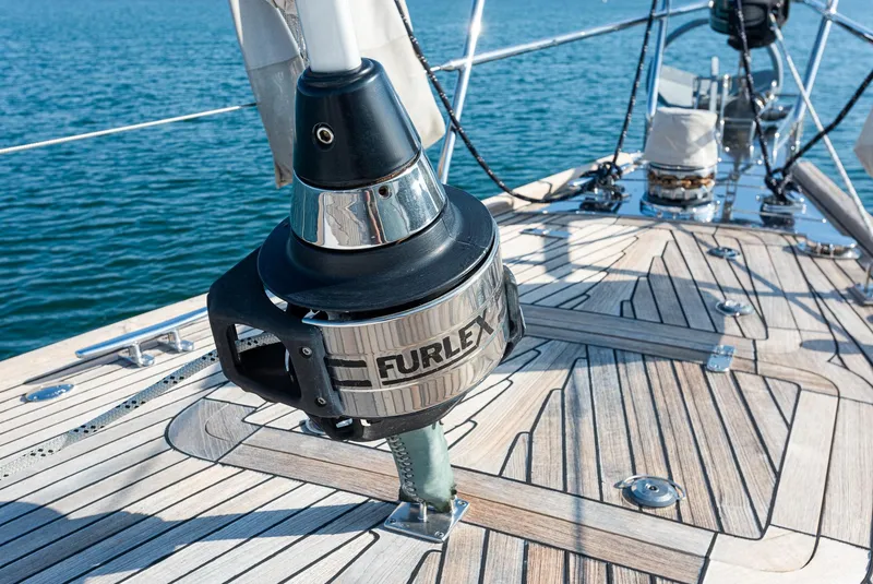 Slide: The Image of Hylas 56 sailboat deck with Furlex system, 2011 model, on calm blue water. - 12