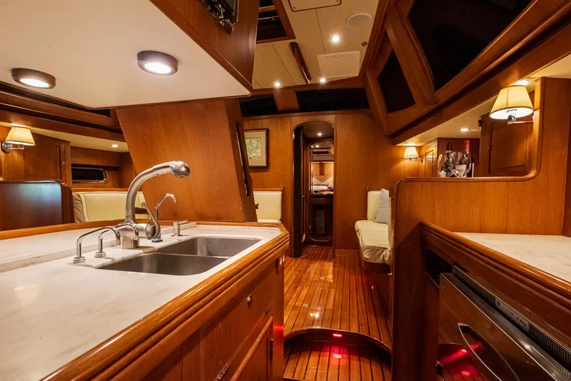 Slide: The Image of Luxurious interior of 2011 Hylas 56 yacht with wooden finishes and modern amenities. - 26