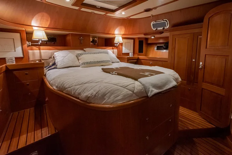 Slide: The Image of Luxurious 2011 Hylas 56 yacht cabin with cozy bed and elegant wood finish. - 27