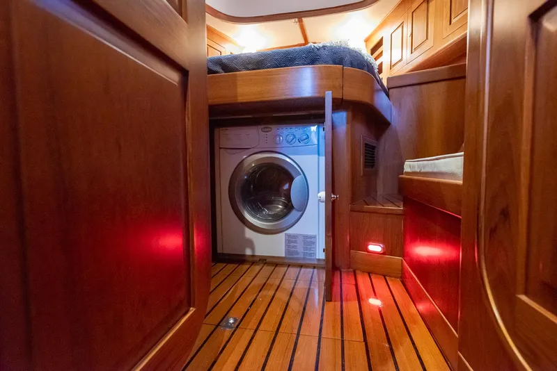 Slide: The Image of Laundry area in 2011 Hylas 56 yacht with wooden interior. - 17