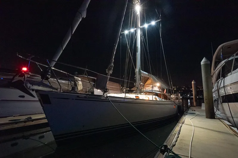 Slide: The Image of Sailing yacht Hylas 56, 2011 model, docked at night with illuminated mast. - 31
