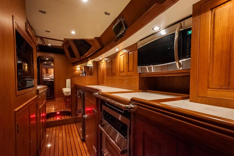Slide: The Image of Luxurious wooden interior of a 2011 Hylas 56 yacht kitchen. - 25