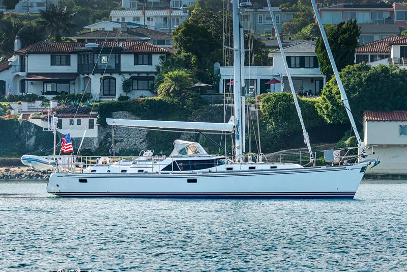Slide: The Image of Sailing yacht Hylas 56, 2011 model, anchored near coastal homes. - 5