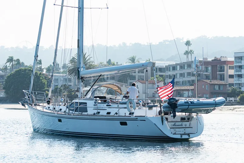Slide: The Image of Sailing yacht Hylas 56 (2011) on calm waters with American flag. - 2