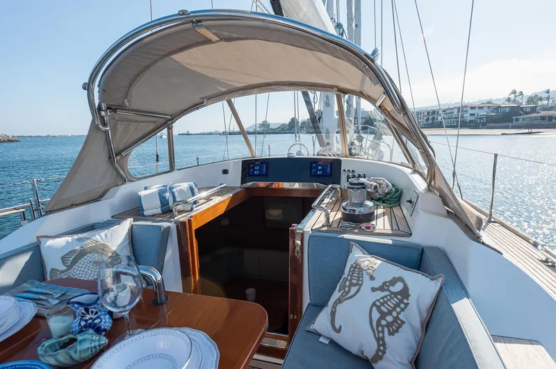 Slide: The Image of Luxurious 2011 Hylas 56 yacht interior with elegant seating and dining area. - 9