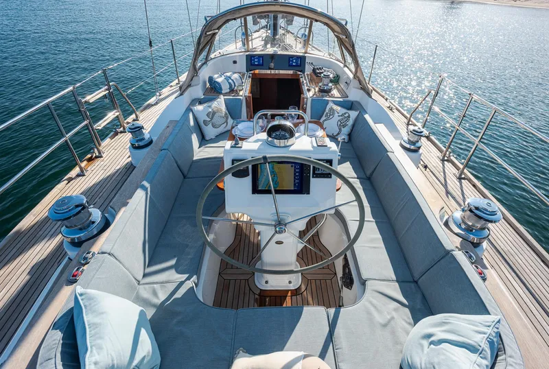Slide: The Image of Luxurious 2011 Hylas 56 yacht interior with spacious seating and modern navigation equipment. - 7