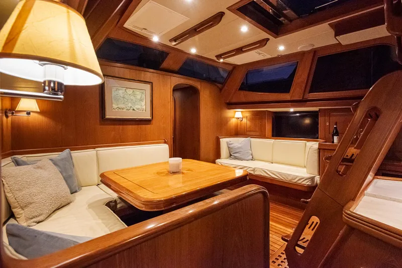 Slide: The Image of Luxurious interior of a 2011 Hylas 56 yacht with elegant wood finish and cozy seating. - 22