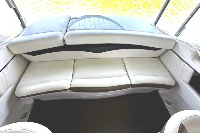 Slide: The Image of 2007 Four Winns 200 Horizon boat interior with white cushioned seating. - 11