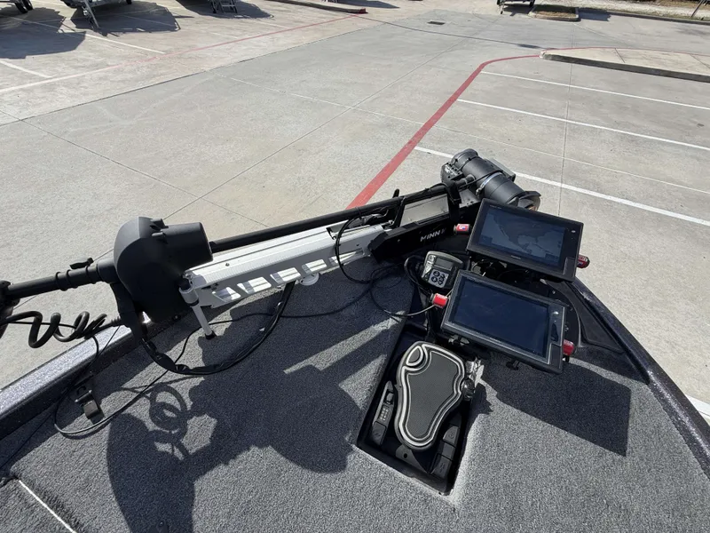 Slide: The Image of The image shows the cockpit of a 2018 Falcon F205 boat with modern navigation equipment. - 30