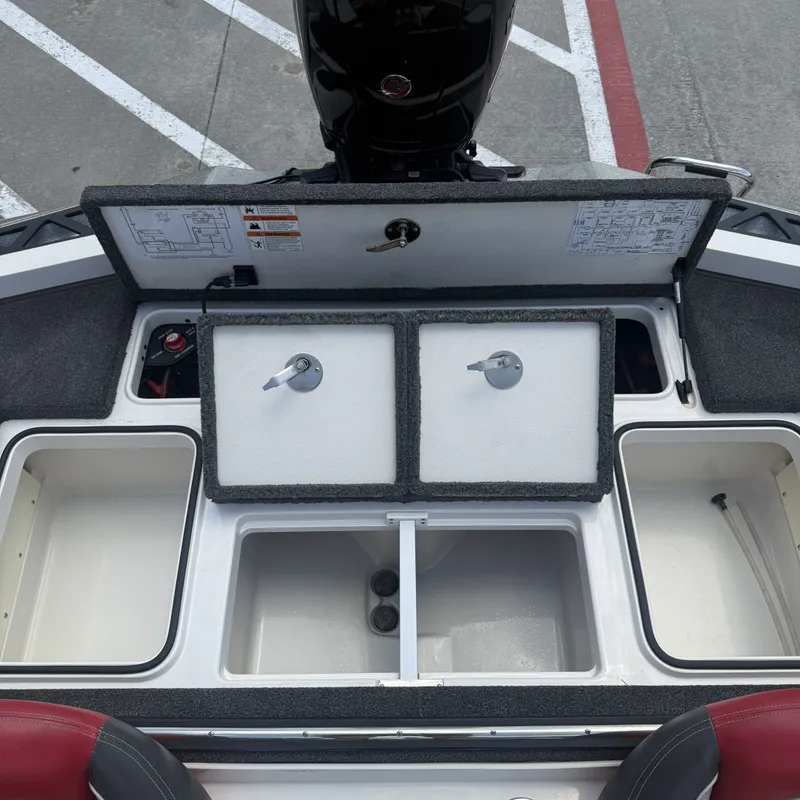 Slide: The Image of The image shows the rear of a 2019 Ranger Z518 boat with open storage compartments. - 22