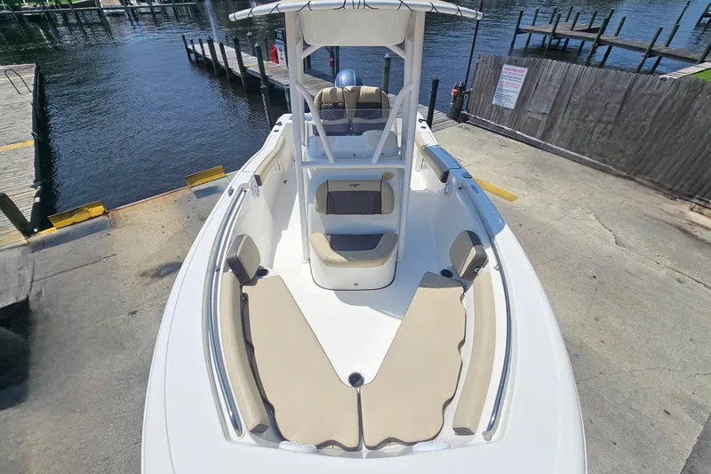 Slide: The Image of 2019 Tidewater 210 LXF boat docked, featuring spacious seating and sleek design. - 25