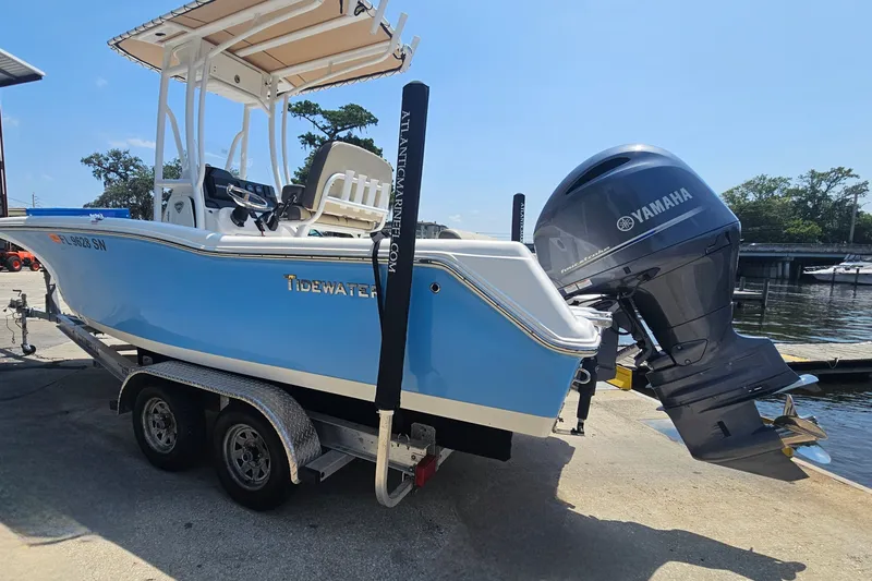 Slide: The Image of 2019 Tidewater 210 LXF boat with Yamaha engine on trailer by the water. - 9