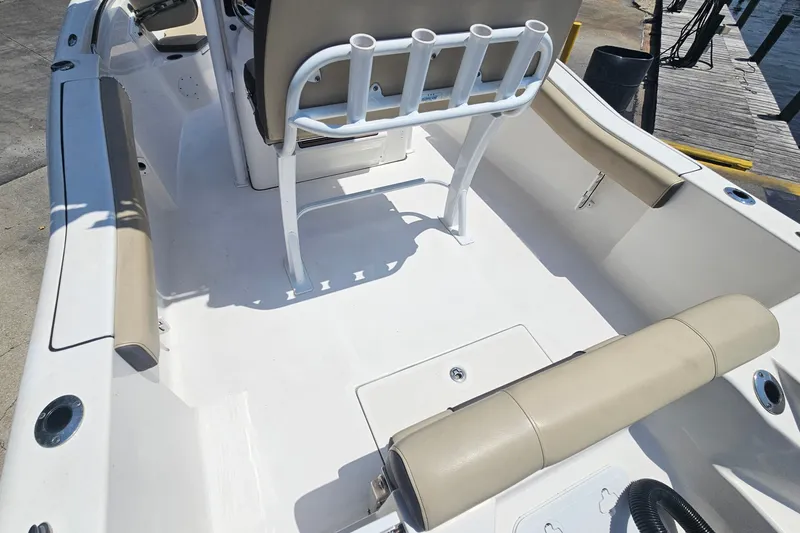 Slide: The Image of 2019 Tidewater 210 LXF boat interior with beige seating and rod holders. - 18