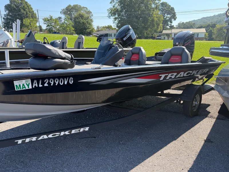 The Image of A black Tracker boat, model Pro Team 190, year 2025, sits on a trailer outdoors. - 1