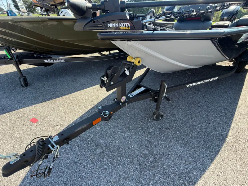 Slide: The Image of A Tracker Pro Team 190 boat on a trailer, equipped with a Minn Kota trolling motor. - 22