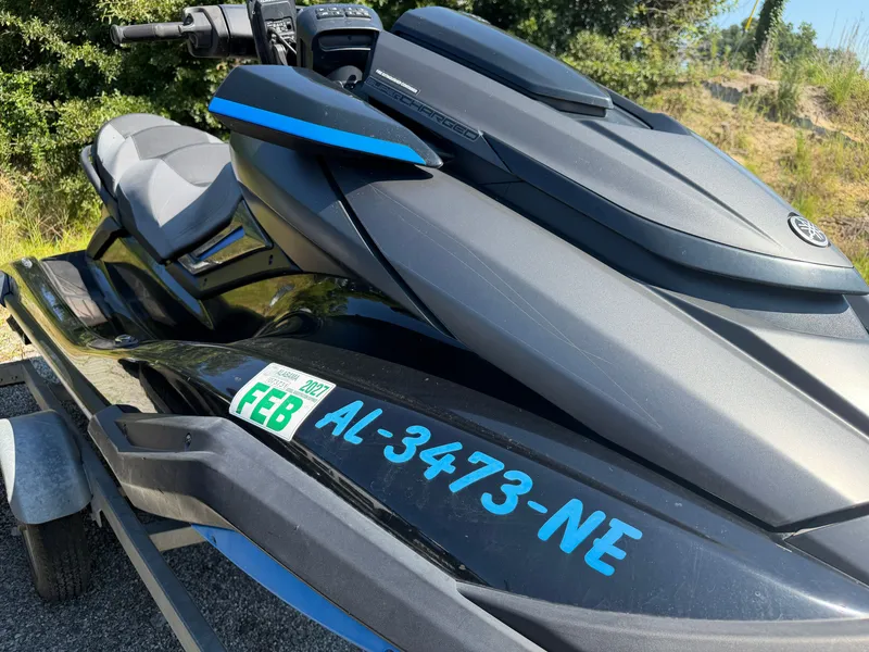 Slide: The Image of A 2020 Yamaha FX Cruise Super Charger jet ski on a trailer, featuring blue markings. - 8