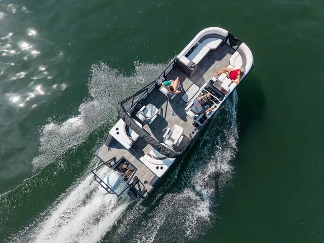 The Image of Aerial view of a 2027 Viaggio Z24Q on the water. Several people are relaxing on board. - 1