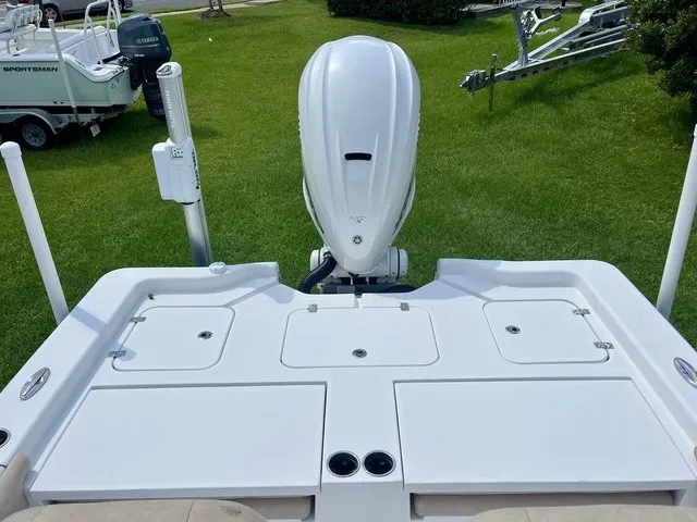 Slide: The Image of The image shows the stern of a 2020 Sportsman Masters 267 Bay Boat with an outboard motor. - 17