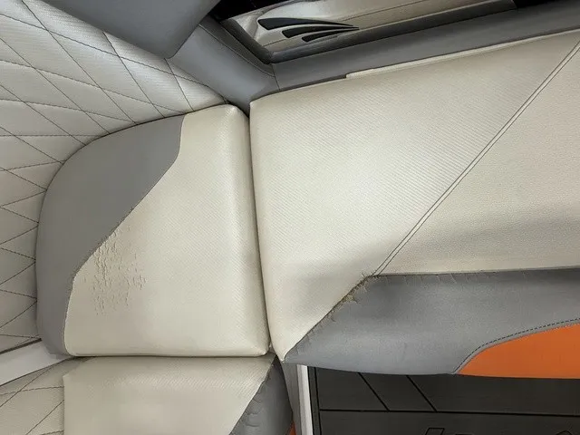 Slide: The Image of Close-up of a boat seat's upholstery with gray and white leather covers. - 21