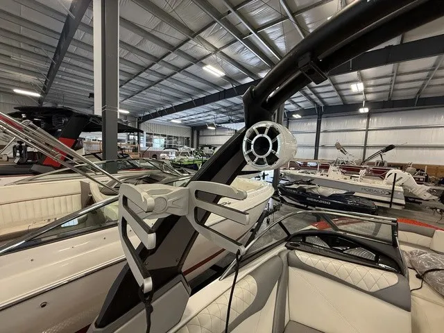 Slide: The Image of The image shows the interior of a 2017 Tigé Z3 boat in a warehouse. - 27