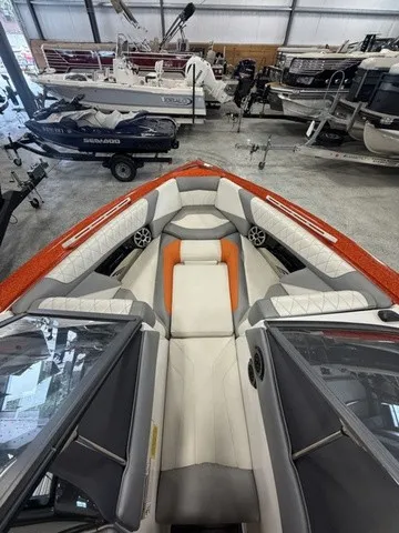 Slide: The Image of The image shows the interior of a 2017 Tigé Z3 boat with gray and orange seating. - 17