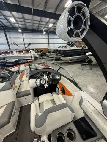 Slide: The Image of The image shows the cockpit of a 2017 Tigé Z3 boat in a storage facility. - 26