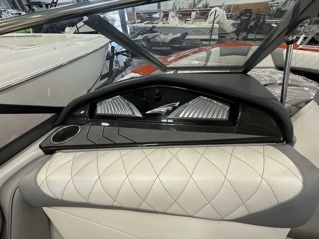 Slide: The Image of The image shows the interior of a 2017 Tigé Z3 boat with sleek upholstery and a cup holder. - 22