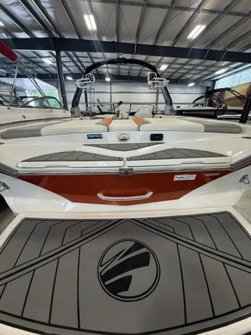 Slide: The Image of The image shows the rear of a 2017 Tigé Z3 boat in a warehouse. - 14