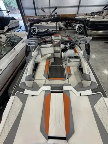 Slide: The Image of The image shows the interior of a 2017 Tigé Z3 boat with orange and gray accents. - 15