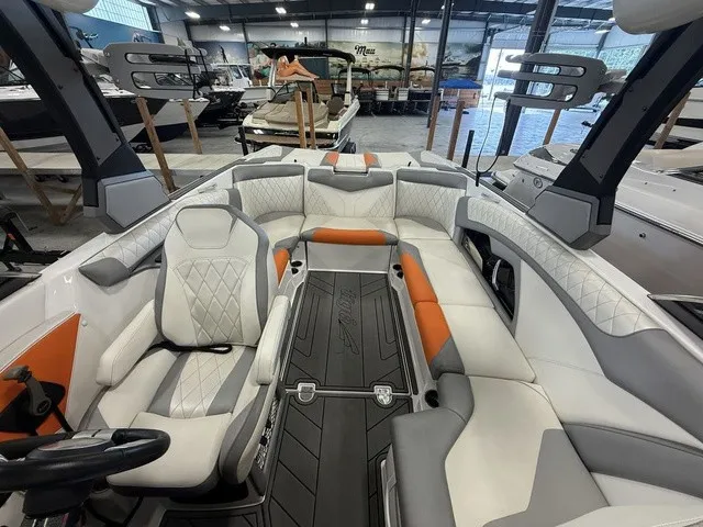 Slide: The Image of The image shows the interior of a 2017 Tigé Z3 boat with modern, cushioned seating. - 19