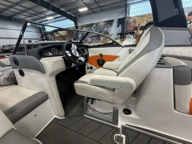 Slide: The Image of The image shows the cockpit of a 2017 Tigé Z3 with a sleek steering wheel and comfortable seating. - 25
